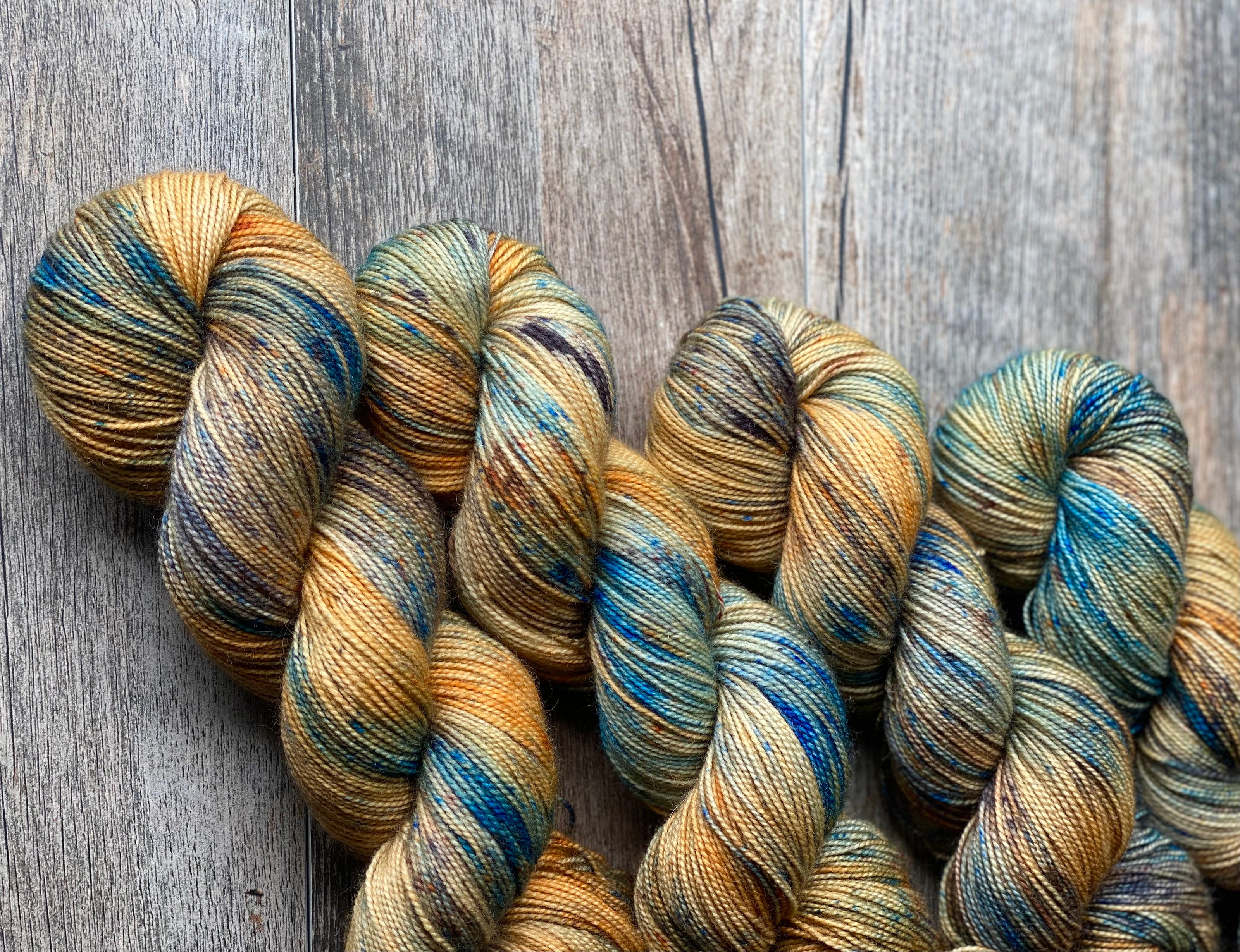 Rust and blue hand dyed yarn skeins